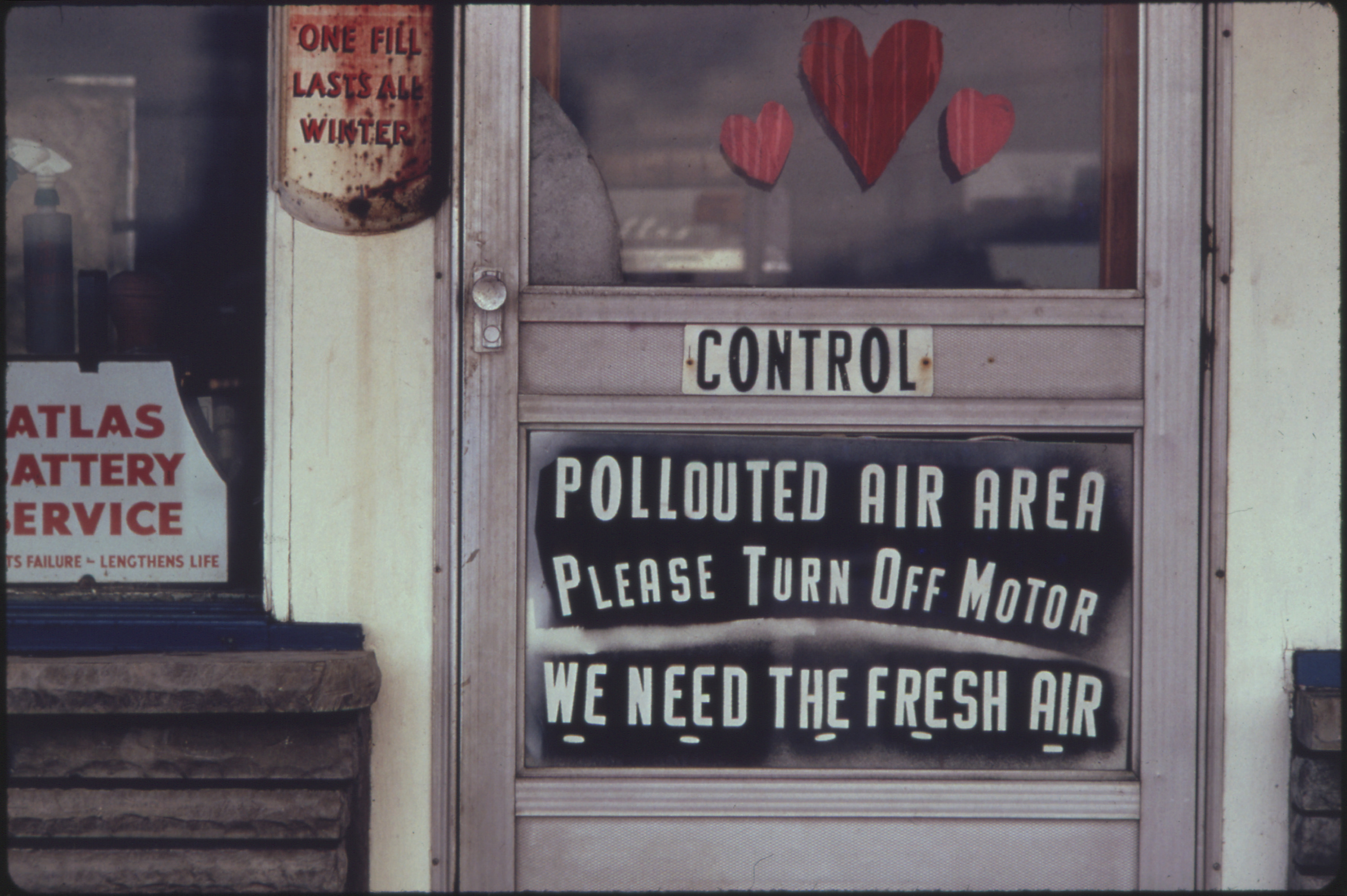 1970s era photo of a door that reads 