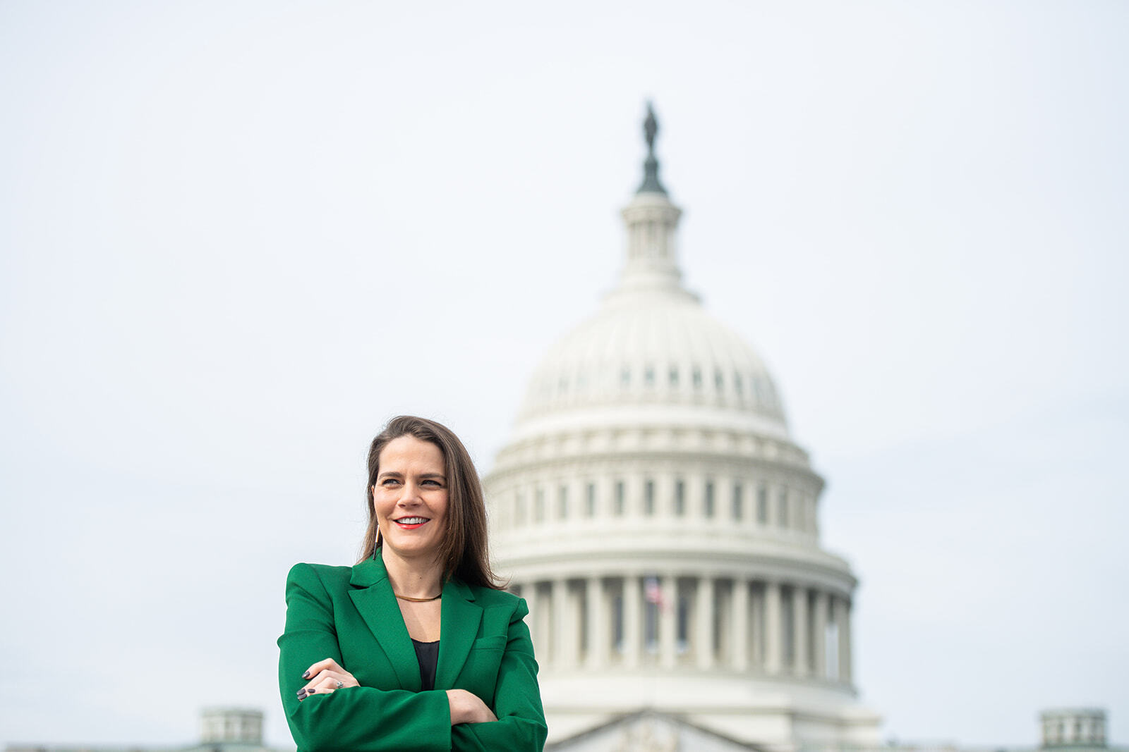 Executive director of Evergreen Action Lena Moffitt in front of the U.S. Capitol Building.