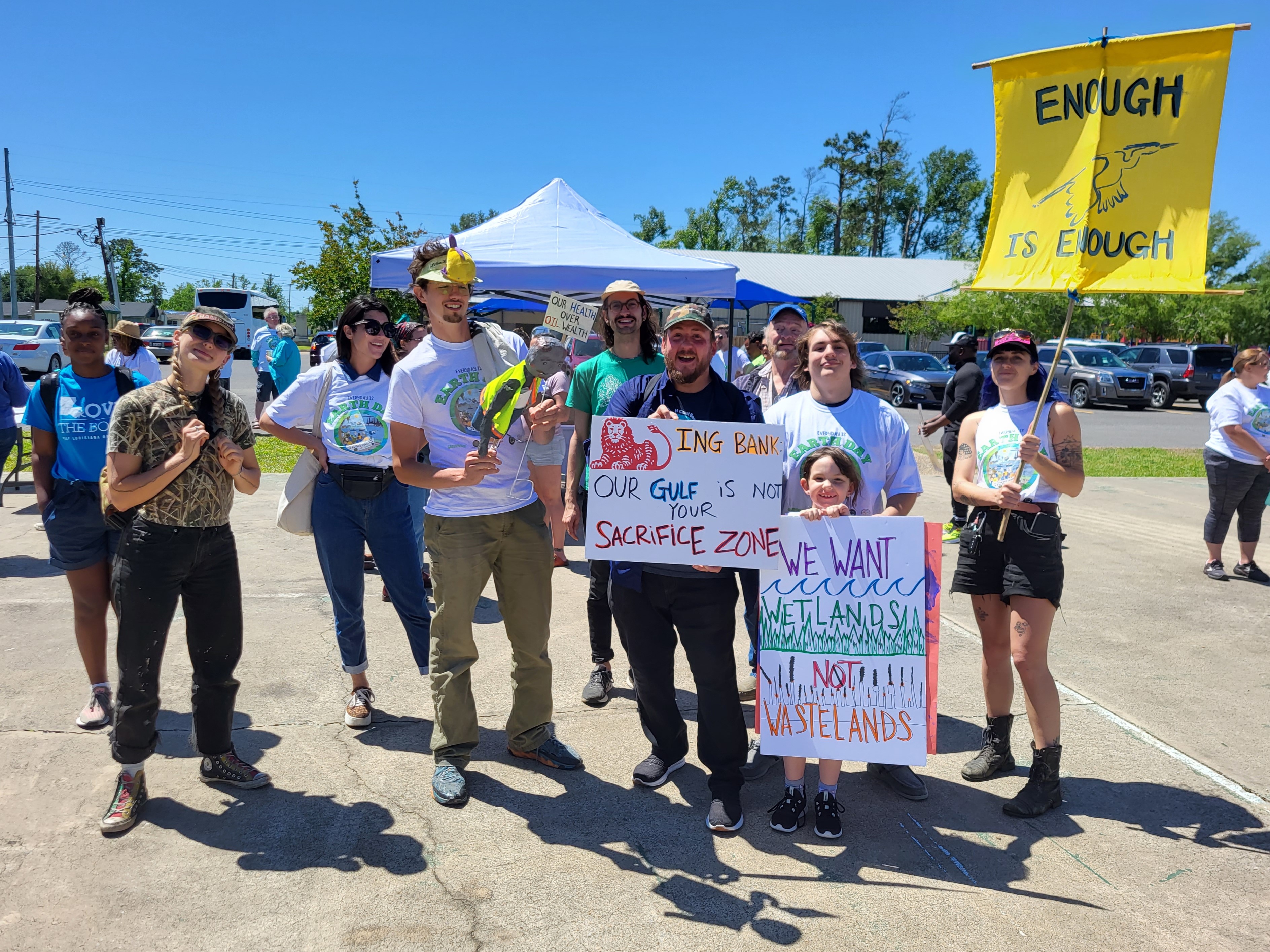 James Hiatt and his community holding anti-LNG signs at a climate protest